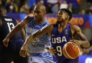 Xavier Munford drives by Jayson Granger