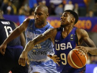 Xavier Munford drives by Jayson Granger